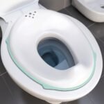 Novo Baby Portable Baby Unisex Potty Training Toilet Seat with Non-Slip Base, Splash Guard, and Storage Hook – Ideal for 0-6 Year Child, Fits Round & Oval Toilets, Toddler Travel-Friendly New born